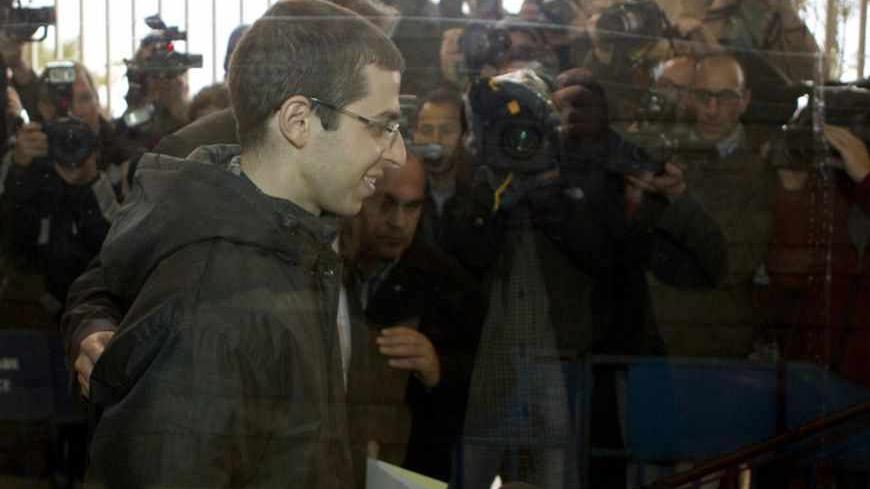 Recently-freed Israeli soldier Gilad Shalit leaves after meeting with Christophe Bigot, the French ambassador to Israel (not pictured) at the French embassy in Tel Aviv January 11, 2012. During the meeting, Shalit gave the ambassador a letter addressed to French President Nicolas Sarkozy. Shalit returned home in October 2011 in a thousand-for-one prisoner swap which ended his five years of captivity in the Gaza Strip. REUTERS/Jack Guez/Pool (ISRAEL - Tags: POLITICS) - RTR2W5D2