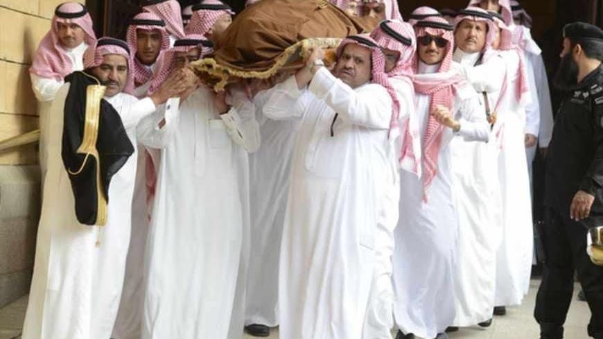 The body of Saudi Arabia's Prince Badr bin Abdul Aziz, former deputy commander of the National Guard is lifted during his funeral at Imam Turki bin Abdullah Mosque in Riyadh, April 2, 2013. REUTERS/Faisal Al Nasser (SAUDI ARABIA - Tags: POLITICS MILITARY ROYALS OBITUARY) - RTXY5U5