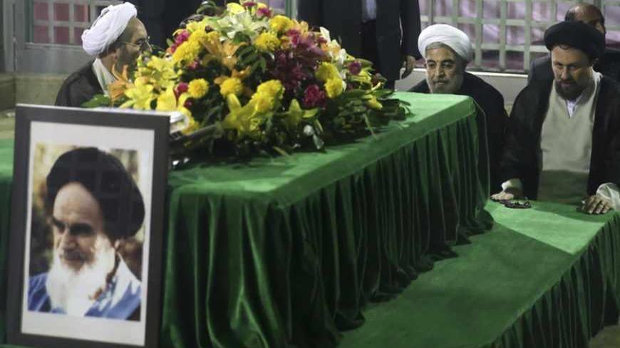 Iranian President-elect Hassan Rohani (2nd R) pays his respects to the grave of the founder of the Islamic Republic Ayatollah Ruhollah Khomeini at his mausoleum in Tehran June 16, 2013. Reuters/Fars News/Seyed Hassan Mousavi   (IRAN - Tags: POLITICS) ATTENTION EDITORS - THIS IMAGE WAS PROVIDED BY A THIRD PARTY. FOR EDITORIAL USE ONLY. NOT FOR SALE FOR MARKETING OR ADVERTISING CAMPAIGNS. THIS PICTURE IS DISTRIBUTED EXACTLY AS RECEIVED BY REUTERS, AS A SERVICE TO CLIENTS - RTX10Q4E