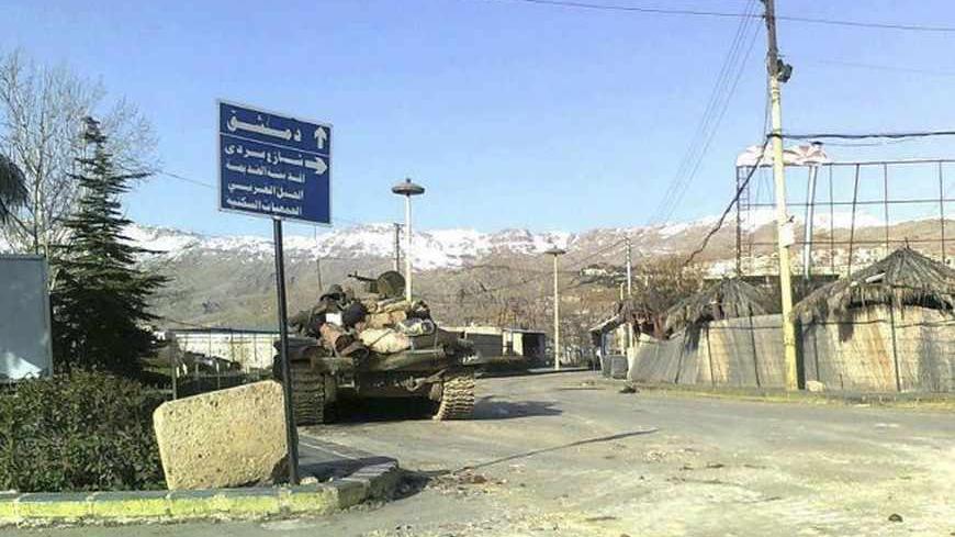 A tank is seen in a neighbourhood of Zabadani, near Damascus, February 14, 2012. Syrian government forces launched an offensive on the city of Hama early on Wednesday, firing on residential neighbourhoods from armoured vehicles and mobile anti-aircraft guns, opposition activists said.   REUTERS/Handout (SYRIA - Tags: CIVIL UNREST POLITICS MILITARY) FOR EDITORIAL USE ONLY. NOT FOR SALE FOR MARKETING OR ADVERTISING CAMPAIGNS. THIS IMAGE HAS BEEN SUPPLIED BY A THIRD PARTY. IT IS DISTRIBUTED, EXACTLY AS RECEIVE