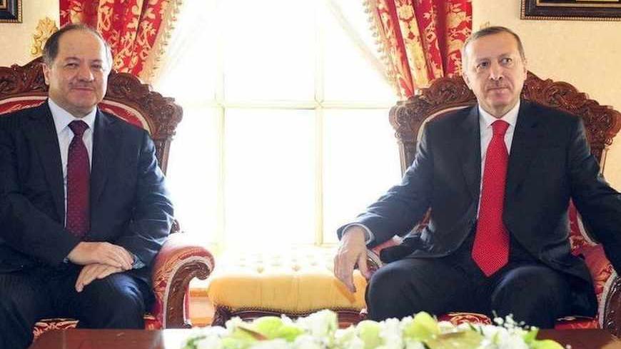 Turkish Prime Minister Tayyip Erdogan (R) and Kurdistan Regional President Masoud Barzani pose for the media before their meeting in Istanbul April 19, 2012. REUTERS/Stringer/Pool (TURKEY - Tags: POLITICS) - RTR30XVX