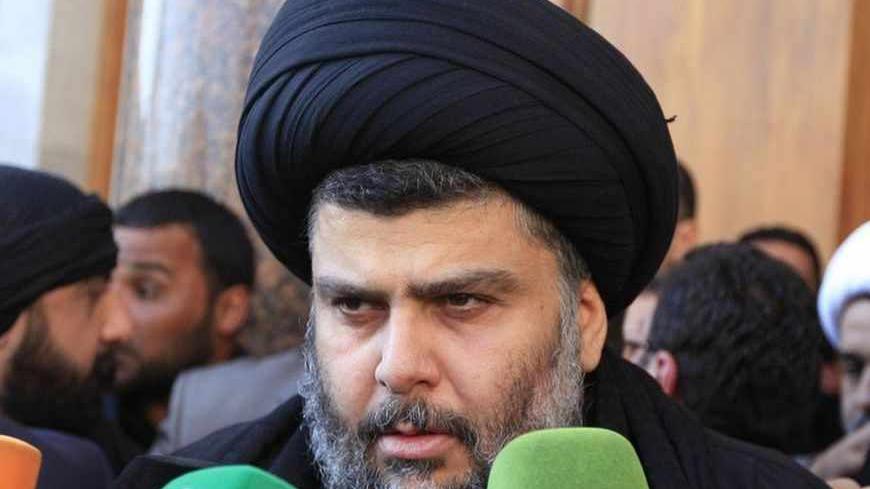 Iraqi Shi'ite cleric Moqtada al-Sadr speaks to the media during a visit to the Our Lady of Salvation Church in Baghdad January 4, 2013.  REUTERS/Thaier Al-Sudani (IRAQ - Tags: RELIGION) - RTR3C3HO