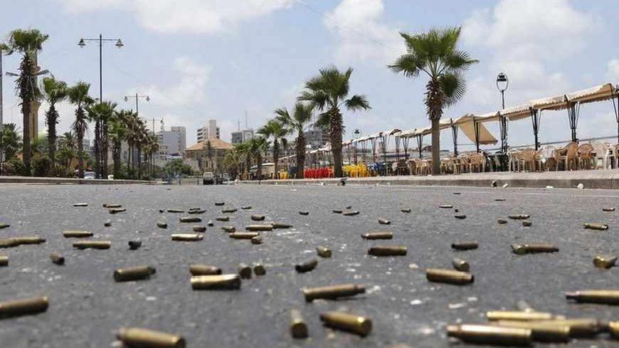 Bullet casings are seen on a street , during clashes with gunmen of hardline Sunni Muslim cleric Sheikh Ahmed al-Assir, in Sidon, southern Lebanon, June 24, 2013. Lebanese soldiers fought Sunni Muslim gunmen in the southern city of Sidon on Monday in one of the deadliest outbreaks of violence fuelled by sectarian divisions over the civil war in neighbouring Syria. REUTERS/Mohamed Azakir (LEBANON - Tags: POLITICS CIVIL UNREST MILITARY) - RTX10YXN