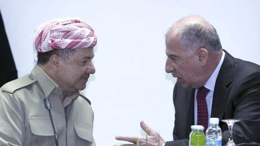 Iraq's Parliament Speaker Osama al-Nujaifi (R) meets with Iraqi Kurdish President Masoud Barzani (L) in Baghdad, July 7, 2013.  Barzani visited Baghdad on Sunday for the first time in more than two years, in a symbolic step to resolve disputes between the central government and the autonomous region over land and oil. The visit follows an equally rare trip by Iraqi Prime Minister Nuri al-Maliki who met Barzani in Kurdistan last month, breaking ice between leaders who have repeatedly accused each other of vi