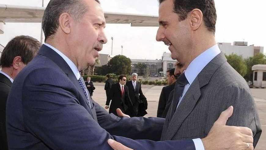 Syria's President Bashar al-Assad (R) welcomes Turkey's Prime Minister Tayyip Erdogan at Damascus airport January 17, 2011. REUTERS/Sana   (SYRIA - Tags: POLITICS) FOR EDITORIAL USE ONLY. NOT FOR SALE FOR MARKETING OR ADVERTISING CAMPAIGNS. THIS IMAGE HAS BEEN SUPPLIED BY A THIRD PARTY. IT IS DISTRIBUTED, EXACTLY AS RECEIVED BY REUTERS, AS A SERVICE TO CLIENTS - RTXWOQH