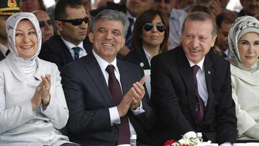 Turkey's Prime Minister Tayyip Erdogan (2nd R) and President Abdullah Gul (2nd L), accompanied by their wives Emine Erdogan (R) and Hayrunnisa Gul (L), attend a groundbreaking ceremony for the third Bosphorus bridge linking the European and Asian sides of Istanbul May 29, 2013. REUTERS/Murad Sezer (TURKEY  - Tags: BUSINESS CONSTRUCTION POLITICS) - RTX10515