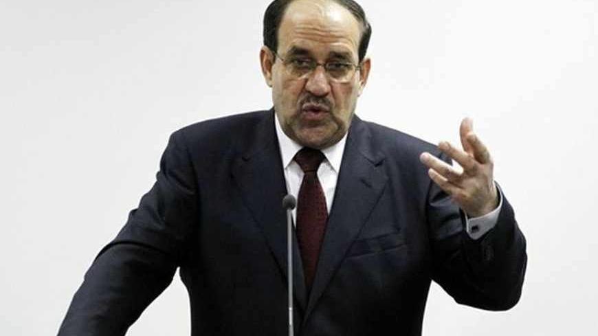 Iraq's Prime Minister Nuri al-Maliki speaks during the opening ceremony of the Defence University for Military Studies inside Baghdad's heavily-fortified Green Zone June 17, 2012.   REUTERS/Thaier al-Sudani (IRAQ - Tags: MILITARY POLITICS) - RTR33R99