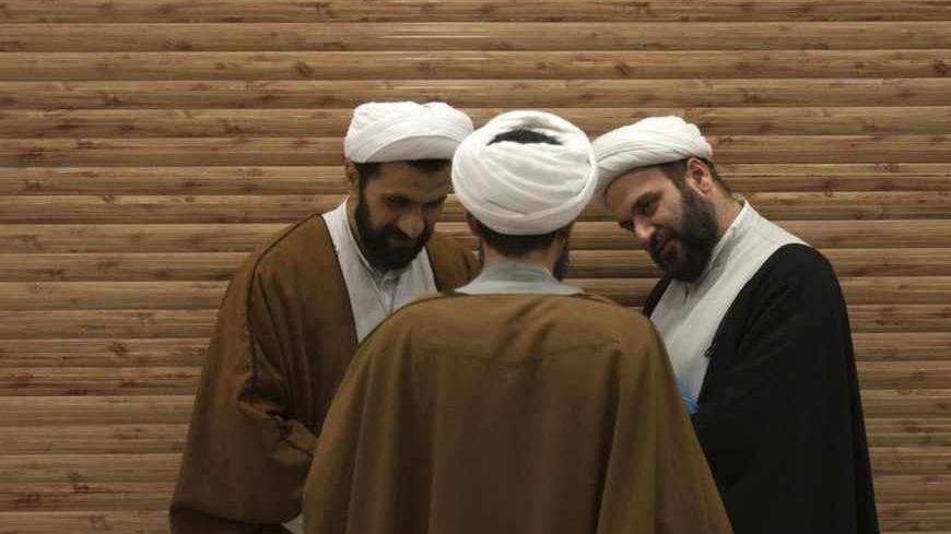EDITORS' NOTE:  Reuters and other foreign media are subject to Iranian restrictions on their ability to film or take pictures in Tehran.

Iranian clerics talk to each other during break time at a religious conference centre in Qom, 120 km (75 miles) south of Tehran, March 9, 2011. The clerics are attending  the International Conference of Religious Doctrines and the Mind-Body Problem. REUTERS/Morteza Nikoubazl (IRAN - Tags: RELIGION SOCIETY) - RTR2JNWP