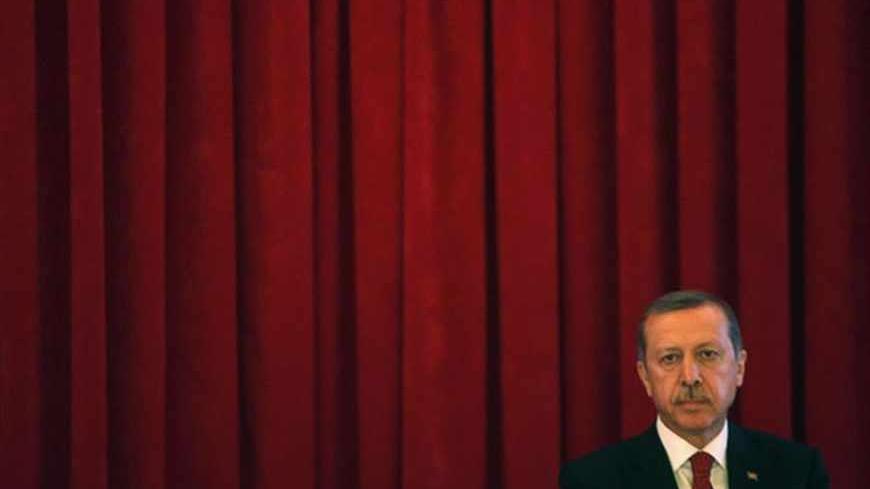 Turkey Prime Minister Tayyip Erdogan is pictured after his speech during conference in Ankara, June 18, 2013.  Police raided addresses across Turkey on Tuesday and detained dozens of people in an operation linked to three weeks of often violent protests against Erdogan. REUTERS/Dado Ruvic (TURKEY - Tags: POLITICS CIVIL UNREST) - RTX10S0B