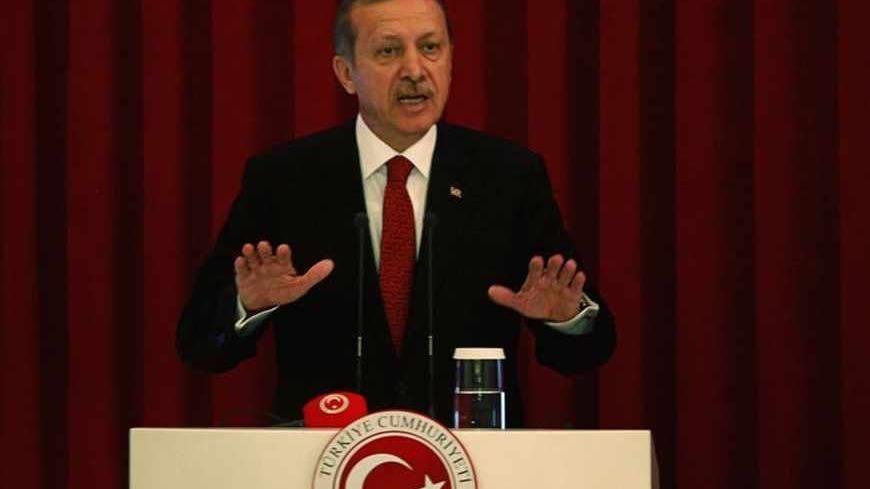 Turkey Prime Minister Tayyip Erdogan speaks during a conference in Ankara, June 18, 2013. REUTERS/Dado Ruvic (TURKEY - Tags: POLITICS CIVIL UNREST) - RTX10S1M