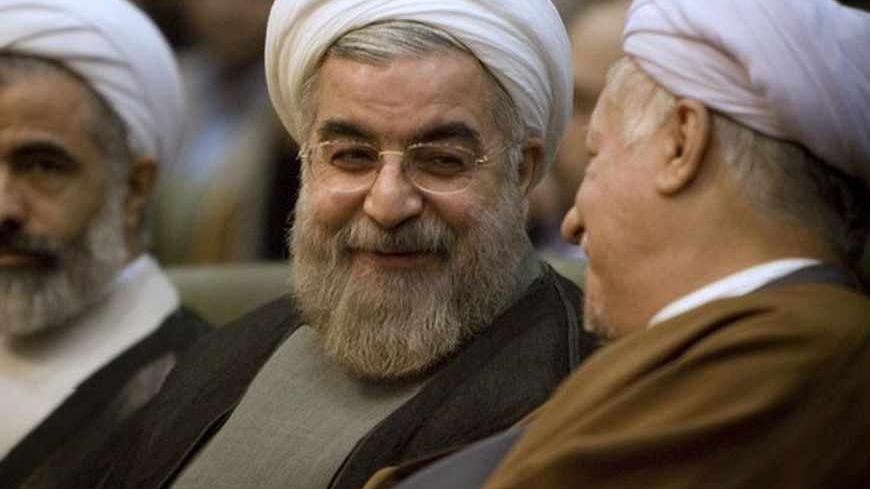 Iran's former chief nuclear negotiator, Hassan Rohani (C), attends a conference called National Unity, Policies and Methods in Tehran November 12, 2007.  REUTERS/Caren Firouz (IRAN) - RTX8ZM