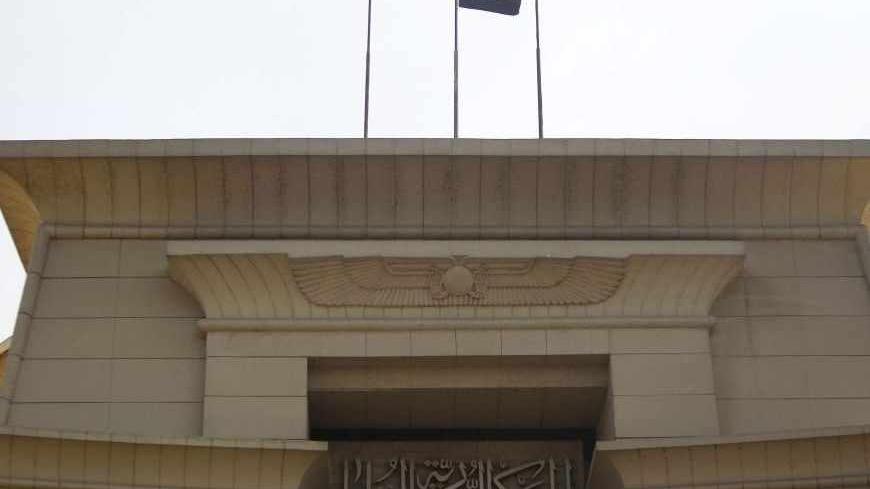 The Egyptian flag is seen at the Supreme Constitutional Court during the swearing in ceremony of the head of the court Adli Mansour as the nation's interim president in Cairo July 4, 2013. Egypt's prosecutor ordered the arrest of the Muslim Brotherhood's leader on Thursday, widening a crackdown against the Islamist movement after the army ousted the country's first democratically elected president Mursi. But Adli Mansour used his inauguration to hold out an olive branch to the Brotherhood. REUTERS/ Amr Abda