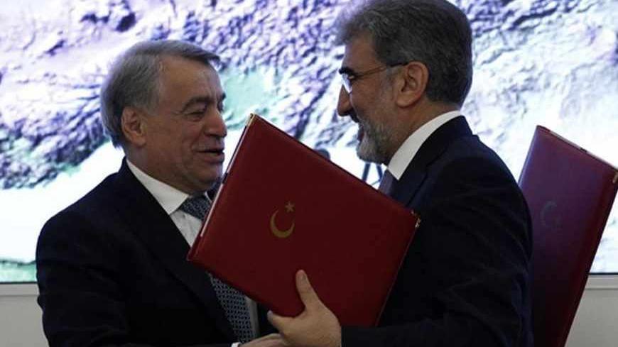 Azeri Energy Minister Natik Aliev (L) and Turkish Energy Minister Taner Yildiz attend the signing ceremony of The Trans-Anatolian gas pipeline project in Ankara December 26, 2011. The Trans-Anatolian gas pipeline project, which will carry Azeri gas across Turkey to Europe, has a capacity of around 35 billion cubic metres (bcm) and can carry 16-24 bcm annually, officials from Turkey and Azerbaijan said on Monday. Azeri state energy company SOCAR, Turkey's state pipeline company Botas and Turkey's state energ