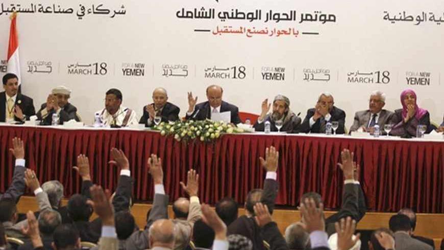 Yemen's President Abd-Rabbu Mansour Hadi (C) takes part in a vote with members of the National Dialogue Committee before the start of the first session of the Conference of National Dialogue in Sanaa March 19, 2013. Mohamed al-Sayaghi (YEMEN - Tags: POLITICS) - RTR3F6LE