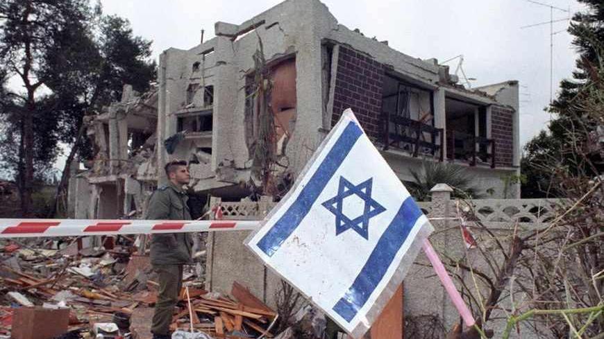 An Israeli soldier inspects a building after it was destroyed during an Iraqi Scud missile attack last night January 26, 1991. At least one person was killed and 69 wounded.   Reuters/Ulli Michel /landov BEST QUALITY AVAILABLE - RTR2P2QB