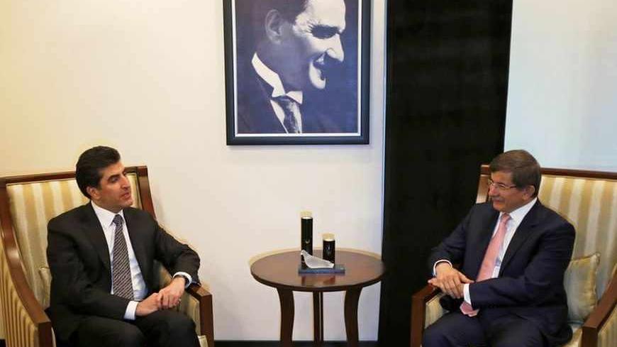 Turkey's Foreign Minister Ahmet Davutoglu (R) meets with Iraq's Kurdish Regional Government (KRG) Prime Minister Nechirvan Barzani in Ankara July 30, 2013.    REUTERS/Umit Bektas (TURKEY - Tags: POLITICS) - RTX1252R