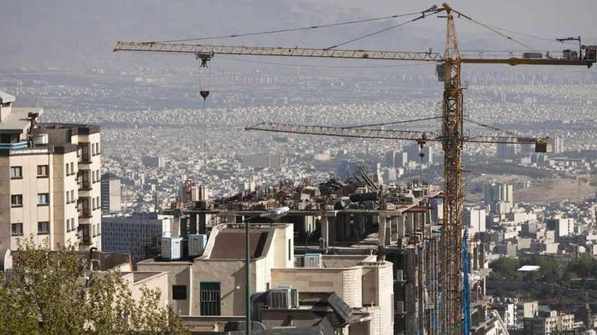 EDITORS' NOTE: Reuters and other foreign media are subject to Iranian restrictions on their ability to report, film or take pictures in Tehran. 

Construction cranes work on a high rise buildings in the foothills of the Alborz mountains in north Tehran April 15, 2010. President Mahmoud Ahmadinejad has asked 5 million Tehranis to evacuate the capital since they know their sprawling metropolis is due for a massive earthquake. When the last major earthquake hit, in 1831, Tehran was tiny compared to the metro