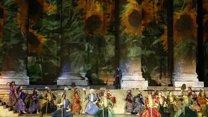 The Caracalla Dance Theatre performs a new theatrical production of "The village" (Al-Dayaa) during a dress rehearsal during the Baalbeck International Festival in Baalbek, in the Bekaa valley, July 14, 2009. The Baalbeck International Festival is an annual entertainment festival that takes place in July and August in the Roman Ruins of the Baalbek Temples. REUTERS/Ahmed Shalha (LEBANON SOCIETY ENTERTAINMENT) - RTR25NWB