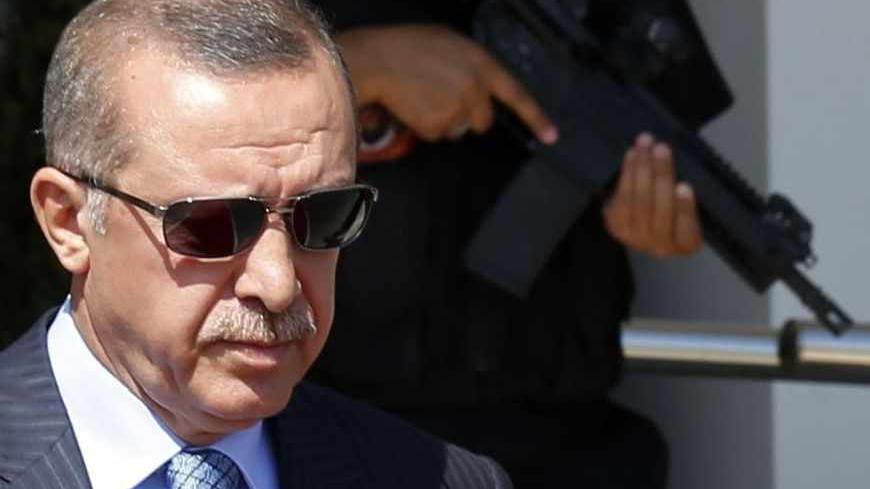 Turkey's Prime Minister Tayyip Erdogan walks to his plane as he leaves for Turkmenistan, at Esenboga Airport in Ankara August 15, 2013.  Erdogan called on Thursday for the U.N. Security Council to convene quickly and act after what he described as a massacre in Egypt, during a news conference in Ankara. REUTERS/Umit Bektas (TURKEY - Tags: POLITICS) - RTX12M4A