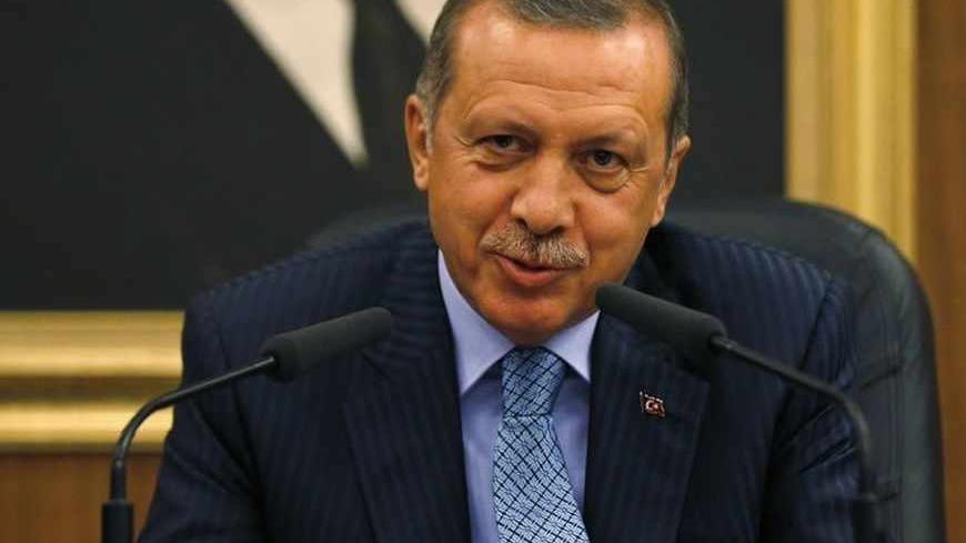 Turkey's Prime Minister Tayyip Erdogan gestures as he addresses the media before leaving for Turkmenistan at Esenboga Airport in Ankara August 15, 2013.  Erdogan called on Thursday for the U.N. Security Council to convene quickly and act after what he described as a massacre in Egypt, during a news conference in Ankara. REUTERS/Umit Bektas (TURKEY - Tags: POLITICS) - RTX12M4D