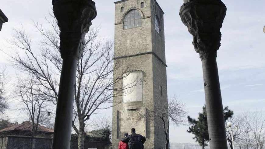A couple visits the site of the 13th century Haghia Sophia Church in Trabzon January 25, 2007. This sleepy Black Sea town is struggling to understand how it could produce youngsters capable of killing in cold blood. Police have charged Ogun Samast, 17, from Trabzon with the murder of prominent Turkish Armenian editor Hrant Dink, a year after another teenager shot dead an Italian Catholic priest as he prayed in his church in the same city.  Picture taken January 25, 2007.   To match feature TURKEY-NATIONALIS
