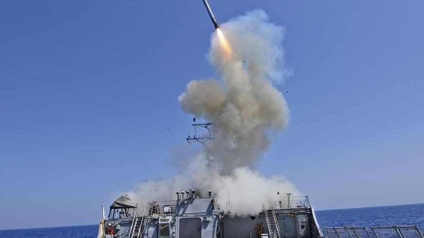 The guided-missile destroyer USS Barry launches a Tomahawk cruise missile from the ship's bow in the Mediterranean Sea in this U.S. Navy handout photo dated March 29, 2011.  Barry is currently supporting Joint Task Force (JTF) Odyssey Dawn.  JTF Odyssey Dawn is the U.S. Africa Command task force established to provide operational and tactical command and control of U.S. military forces supporting the international response to the unrest in Libya and enforcement of United Nations Security Council Resolution 