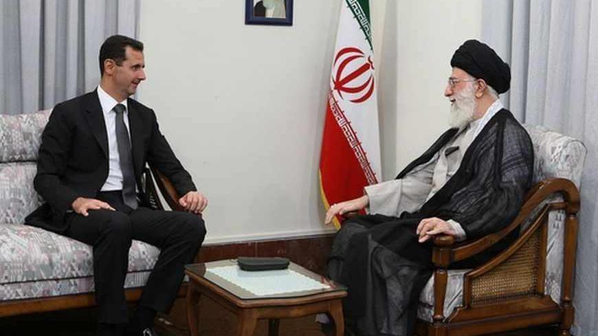 Syrian President Bashar al-Assad (L) attends an official meeting with Iran's Supreme Leader Ayatollah Ali Khamenei in Tehran October 2, 2010. REUTERS/KHAMENEI.IR/Handout (IRAN - Tags: POLITICS) FOR EDITORIAL USE ONLY. NOT FOR SALE FOR MARKETING OR ADVERTISING CAMPAIGNS. THIS IMAGE HAS BEEN SUPPLIED BY A THIRD PARTY. IT IS DISTRIBUTED, EXACTLY AS RECEIVED BY REUTERS, AS A SERVICE TO CLIENTS - RTXSY63