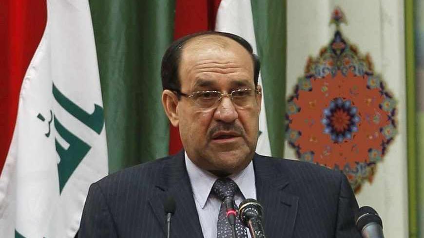 Iraq's Prime Minister Nuri al-Maliki speaks during the International Islamic Conference for the Convergence and Dialogue in Baghdad April 27, 2013. REUTERS/Mohammed Ameen (IRAQ - Tags: POLITICS RELIGION) - RTXZ1MF