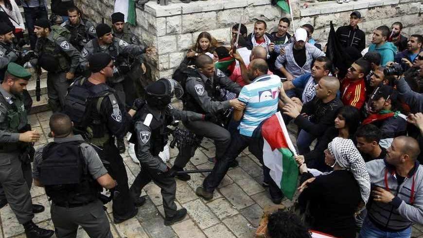 Palestinian protestors clash with Israeli security forces during clashes near Damascus Gate at Jerusalem's old city May 15, 2013. Palestinians clashed with Israeli forces in the occupied West Bank and at East Jerusalem on Wednesday during demonstrations to mark 65 years since what they call the Nakba (Catastrophe) when Israel's creation caused many to lose their homes and become refugees. REUTERS/Ammar Awad (JERUSALEM - Tags: POLITICS CIVIL UNREST CRIME LAW ANNIVERSARY TPX IMAGES OF THE DAY) - RTXZNBX