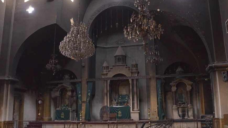 The burnt interior of Kevork Church is pictured after clashes between Free Syrian Army fighters and forces loyal to Syria's President Bashar al-Assad, at the al-Midan area in Aleppo October  30, 2012. REUTERS/George Ourfalian (SYRIA - Tags: CONFLICT CIVIL UNREST POLITICS) - RTR39RY3