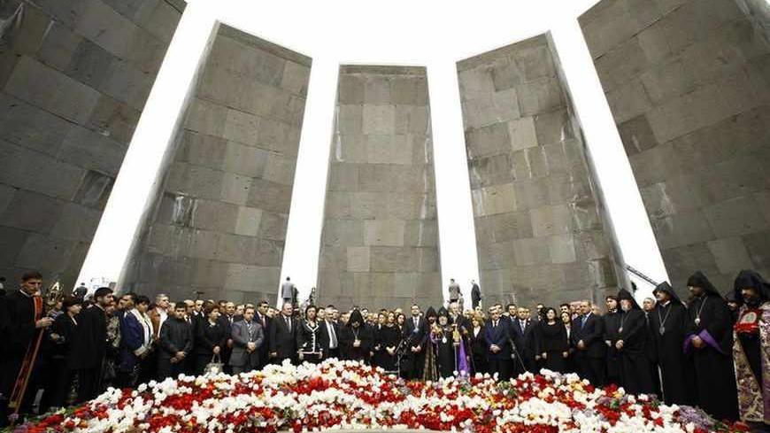People take part in a commemoration ceremony to mark the anniversary of the 1915 mass killings of Armenians in the Ottoman Empire at the Armenian Genocide Memorial in Yerevan, April 24, 2011. Armenia, backed by many historians and world parliaments, says some 1.5 million Armenians died during the upheavals that accompanied World War I and labels the events as genocide. On the other hand, Ankara rejects the term genocide and says large numbers of both Christian Armenians and Muslim Turks were killed.   REUTE