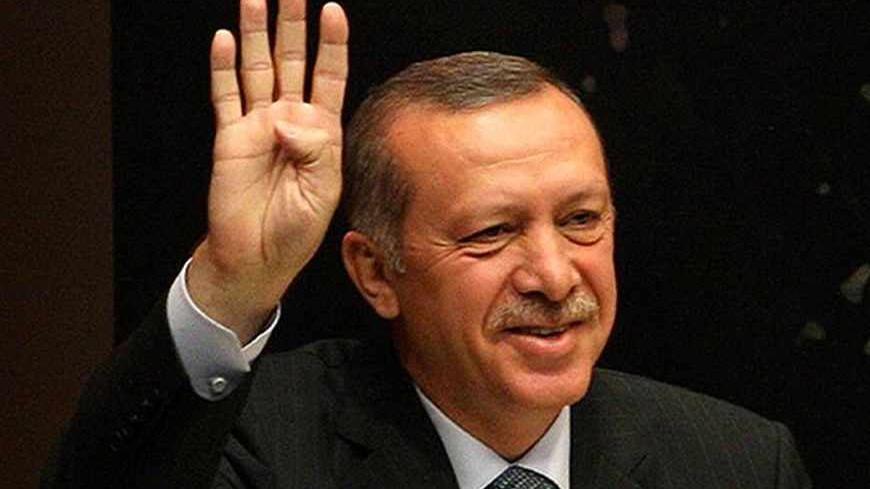 Turkey's Prime Minister Tayyip Erdogan gestures as he gives a speech during a meeting at his ruling Justice and Development Party (AKP) party headquarters in Ankara, on August 20, 2013. Turkish Prime Minister Recep Tayyip Erdogan accused Israel on August 20 of being behind the military-backed ouster of Egypt's Islamist president Mohamed Morsi last month.  AFP PHOTO / ADEM ALTAN        (Photo credit should read ADEM ALTAN/AFP/Getty Images)
