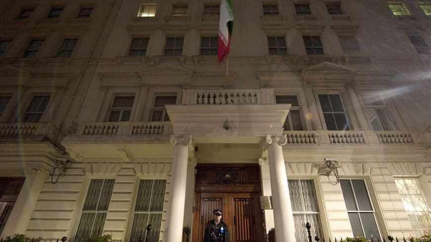 A police officer stands on the step of the Iranian Embassy in central London December 1, 2011. Britain will call for stronger economic sanctions on Iran at a meeting of European Union foreign ministers in Brussels on Thursday following the storming of its embassy in Tehran, UK Foreign Secretary William Hague said on Thursday. REUTERS / Ki Price (BRITAIN - Tags: POLITICS) - RTR2UPPE