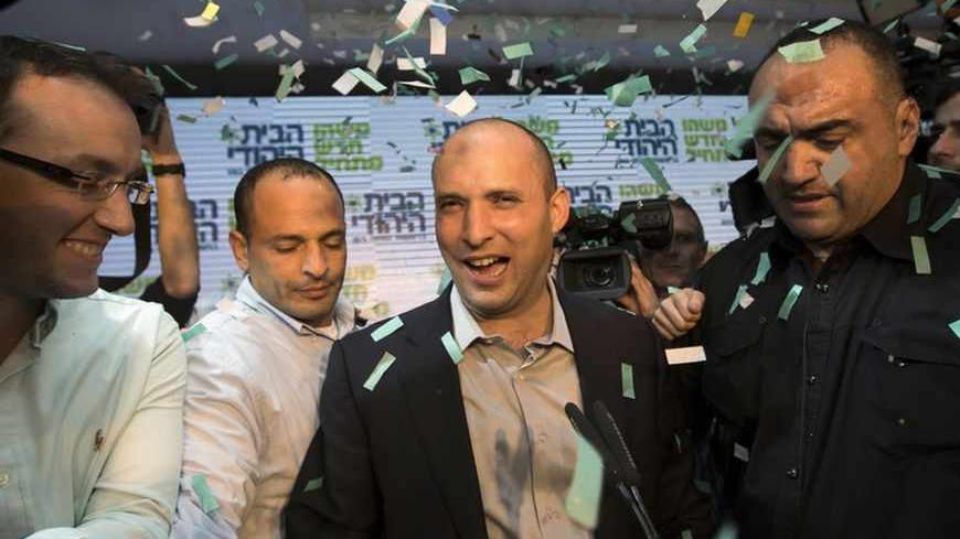 Head of the Bayit Yehudi party Naftali Bennett (C) celebrates at his party's headquarters in Ramat Gan, near Tel Aviv January 22, 2013. Hawkish Prime Minister Benjamin Netanyahu emerged the bruised winner of Israel's election on Tuesday, claiming victory despite unexpected losses to resurgent centre-left challengers. Netanyahu has traditionally looked to religious, conservative parties for backing and is widely expected to seek out self-made millionaire Bennett, who heads the Jewish Home party and stole muc