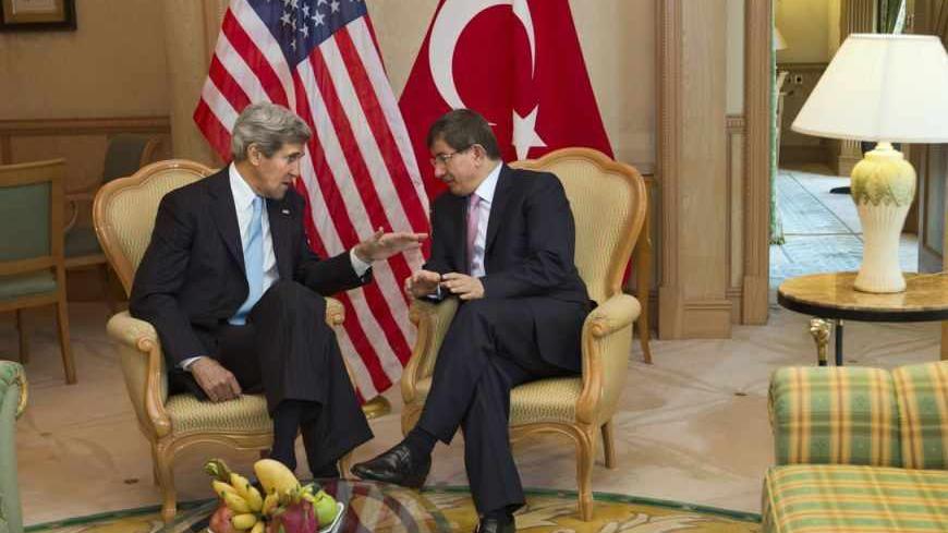 U.S. Secretary of State John Kerry (L) meets with Turkey's Foreign Minister Ahmet Davutoglu before attending the Association of Southeast Asian Nations (ASEAN) security meetings in Bandar Seri Begawan July 2, 2013. REUTERS/Jacquelyn Martin/Pool (BRUNEI - Tags: POLITICS) - RTX119IW