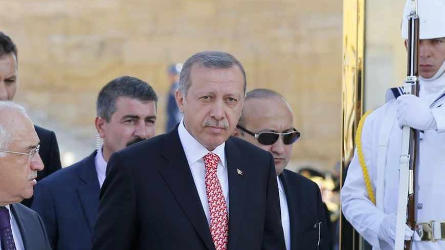 Turkish Prime Minister Tayyip Erdogan (C) attends a ceremony marking the 91st anniversary of Victory Day at the mausoleum of Mustafa Kemal Ataturk, founder of modern Turkey, in Ankara August 30, 2013. REUTERS/Umit Bektas (TURKEY - Tags: POLITICS MILITARY) - RTX131DQ