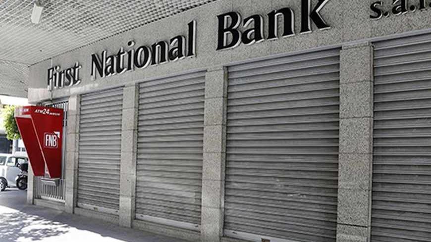 A closed First National Bank branch is seen in Beirut September 4, 2013. Banks and private business corporations saw a one-day strike being held in many parts of Lebanon on Wednesday, organised by economic committees aiming to pressure Lebanese political parties to form a cabinet to maintain the country's economy, local media reported.  REUTERS/Mohamed Azakir (LEBANON - Tags: BUSINESS CIVIL UNREST POLITICS) - RTX136O5