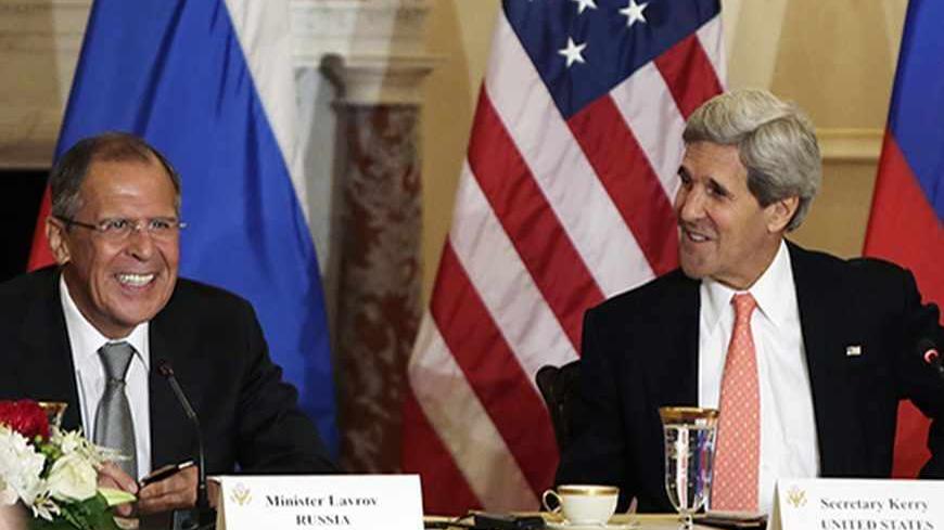 U.S. Secretary of State John Kerry smiles with Russia's Foreign Minister Sergey Lavrov (L)  at a press briefing at the State Department in Washington before a day of talks August 9, 2013. U.S. and Russian officials will seek to maintain a working relationship when they meet in Washington on Friday even though the political mood between the two countries has hit one of its lowest points since the end of the Cold War.    REUTERS/Gary Cameron   (UNITED STATES - Tags: POLITICS) - RTX12F1G