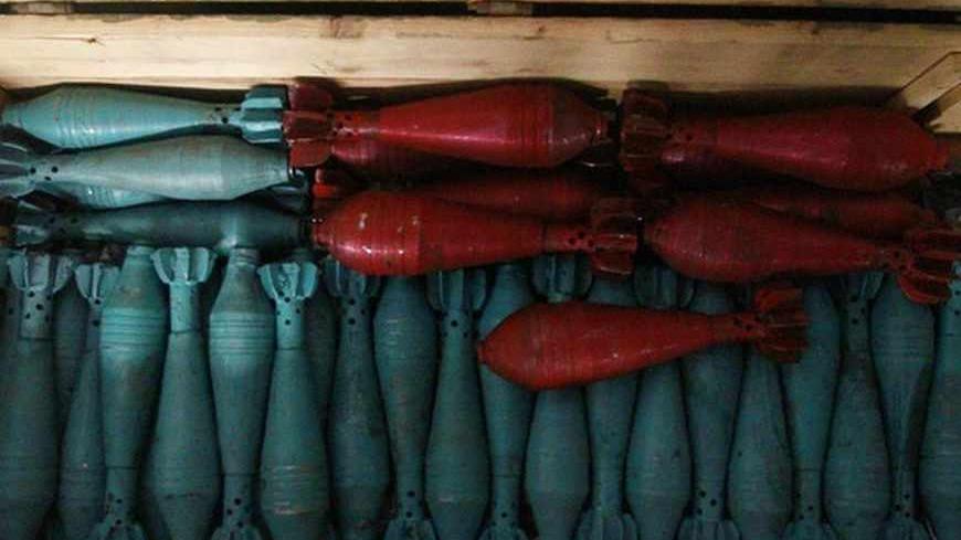 Improvised mortar shells that are colored are seen inside a box at a weapons factory in Aleppo September 4, 2013. REUTERS/Hamid Khatib  (SYRIA - Tags: POLITICS CIVIL UNREST CONFLICT) - RTX1372R