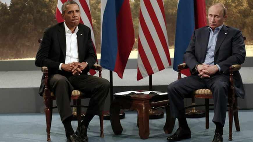 U.S. President Barack Obama (L) meets with Russian President Vladimir Putin during the G8 Summit at Lough Erne in Enniskillen,  Northern Ireland June 17, 2013.   REUTERS/Kevin Lamarque   (NORTHERN IRELAND - Tags: POLITICS TPX IMAGES OF THE DAY) - RTX10R8R