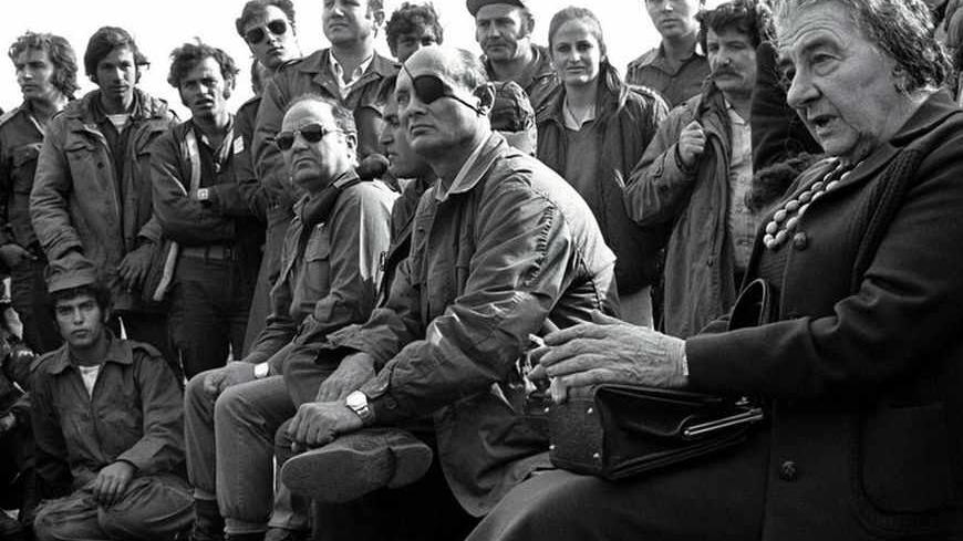 FILE PHOTO 21NOV97 - FOR RELEASE WITH BC-ISRAEL-ANNIVERSARY-CHRONOLOGY - Prime Minister Golda Meir (R) accompanied by her Defense Minister Moshe Dayan, meets with Israeli soldiers at a base on the Golan Heights after intense fighting during the 1973 Yom Kippur War. Israel was simultaneously attacked by Syria and Egypt on Yom Kippur, the Jewish Day of Atonement when all of Israel comes to a standstill, and was only able to defeat both countries when the United States provided an emergency major resupply of e
