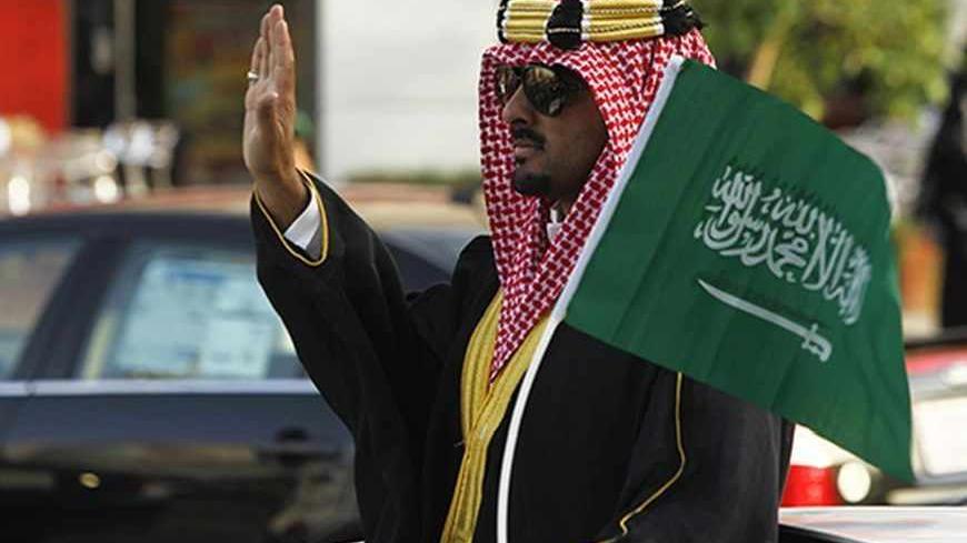 A man celebrates the country's National Day in Riyadh September 23, 2012. REUTERS/Fahad Shadeed (SAUDI ARABIA - Tags: ANNIVERSARY SOCIETY) - RTR38BR3