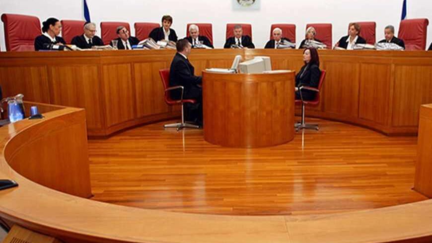 The Israeli High Court's 11 justices prepare to hear petitions filed by
politicians banned from participating in the January 28 general
elections in Jerusalem January 7, 2003. Among the petitioners are two
Israeli Arabs and two Jewish extremists. REUTERS/Gil Cohen Magen

GCM/FMS - RTRG6N0