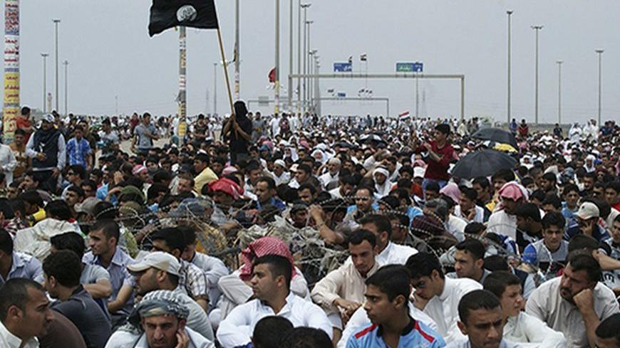Iraqi Sunni Muslims participate in an anti-government demonstration in Falluja, 50 km (31 miles) west of Baghdad May 3, 2013. Tens of thousands of Sunni Muslims poured onto the streets of Ramadi and Falluja in the western province of Anbar following Friday prayers, in their biggest show of strength since the outbreak of protests last year. REUTERS/Mohanned Faisal (IRAQ - Tags: RELIGION POLITICS CIVIL UNREST) - RTXZ985