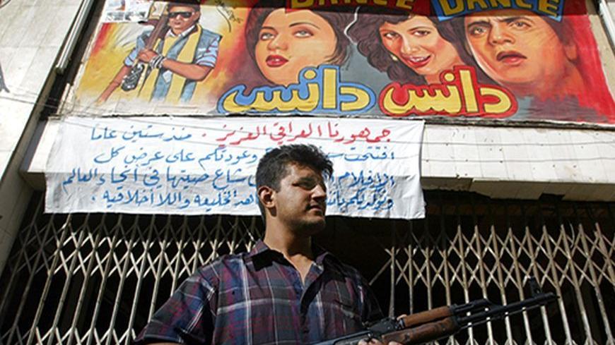 An Iraqi man armed with an AK-47 stands guard in front of a cinema in
Baghdad, May 23, 2003. Shi'ite conservative muslims have warned cinemas
not to play erotic movies. A month after Saddam's fall, theaters have
already started to show European, Turkish or American movies containing
nudity, but are feeling the pressure from clerics to stop airing them.
REUTERS/Jamal Saidi

JD/WS - RTRO57Y