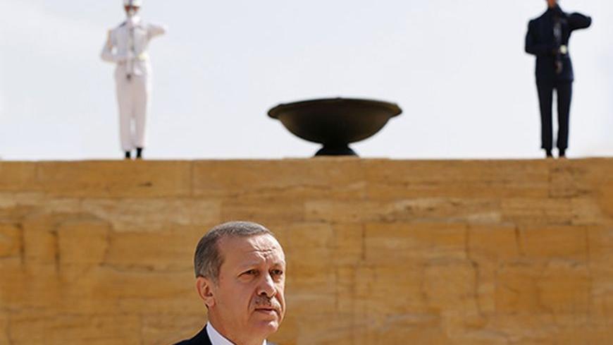 Turkey's Prime Minister Tayyip Erdogan leaves after a wreath-laying ceremony at the mausoleum of Mustafa Kemal Ataturk, founder of modern Turkey, in Ankara August 1, 2013. REUTERS/Umit Bektas (TURKEY - Tags: MILITARY POLITICS) - RTX126OM