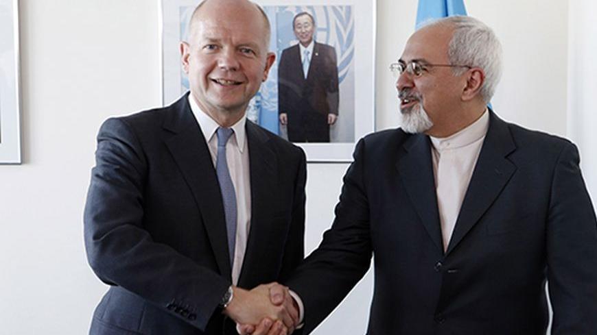 British Foreign Minister William Hague (L). shakes hands with Iran's Foreign Minister Mohammad Javad Zarif at the beginning of their bilateral meeting at the United Nations in New York September 23, 2013.   REUTERS/Jason DeCrow/Pool  (UNITED STATES - Tags: POLITICS) - RTX13X4G
