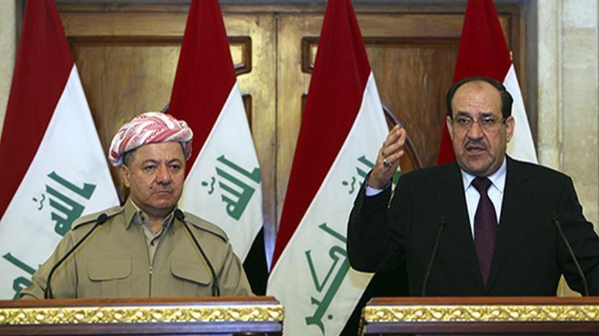 Iraqi Prime Minister Nuri al-Maliki (R) and Iraqi Kurdish President Masoud Barzani (L) hold a joint news conference in Baghdad, July 7, 2013. Barzani visited Baghdad on Sunday for the first time in more than two years, in a symbolic step to resolve disputes between the central government and the autonomous region over land and oil. The visit follows an equally rare trip by Iraqi Prime Minister Nuri al-Maliki who met Barzani in Kurdistan last month, breaking ice between leaders who have repeatedly accused ea