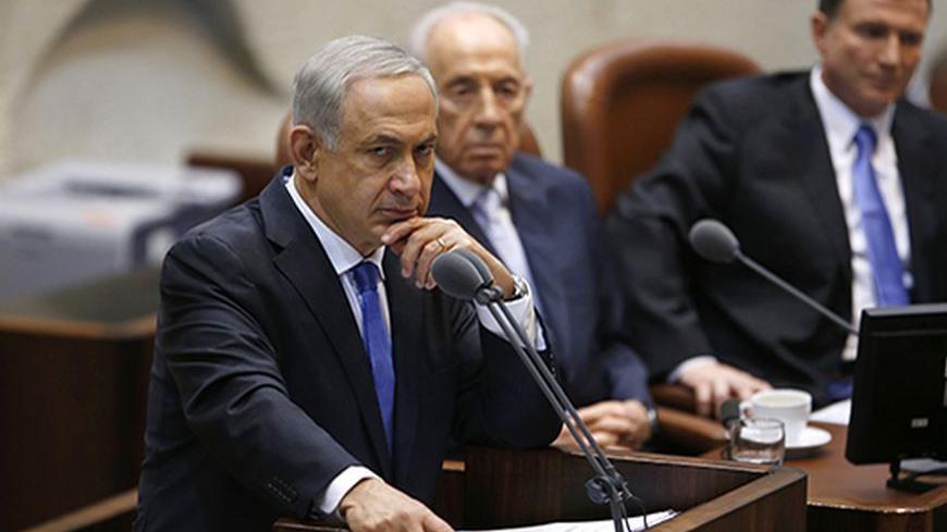 Israel's Prime Minister Benjamin Netanyahu pauses during his speech at the opening of the winter session of the Knesset, the Israeli parliament, in Jerusalem October 14, 2013. REUTERS/Ronen Zvulun (JERUSALEM - Tags: POLITICS) - RTX14AZN