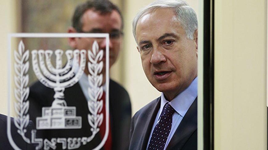 Israeli Prime Minister Benjamin Netanyahu is seen through a glass door as he arrives to deliver joint statements with Czech Republic's President Milos Zeman (not pictured) in Jerusalem October 7, 2013. Zeman began on Monday his three-day visit to Israel. REUTERS/Baz Ratner (JERUSALEM - Tags: POLITICS) - RTR3FOTH